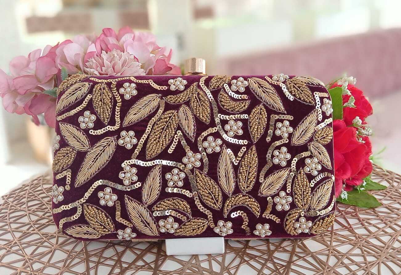 Bottega Veneta burgundy clutch handbag | Millea Brothers